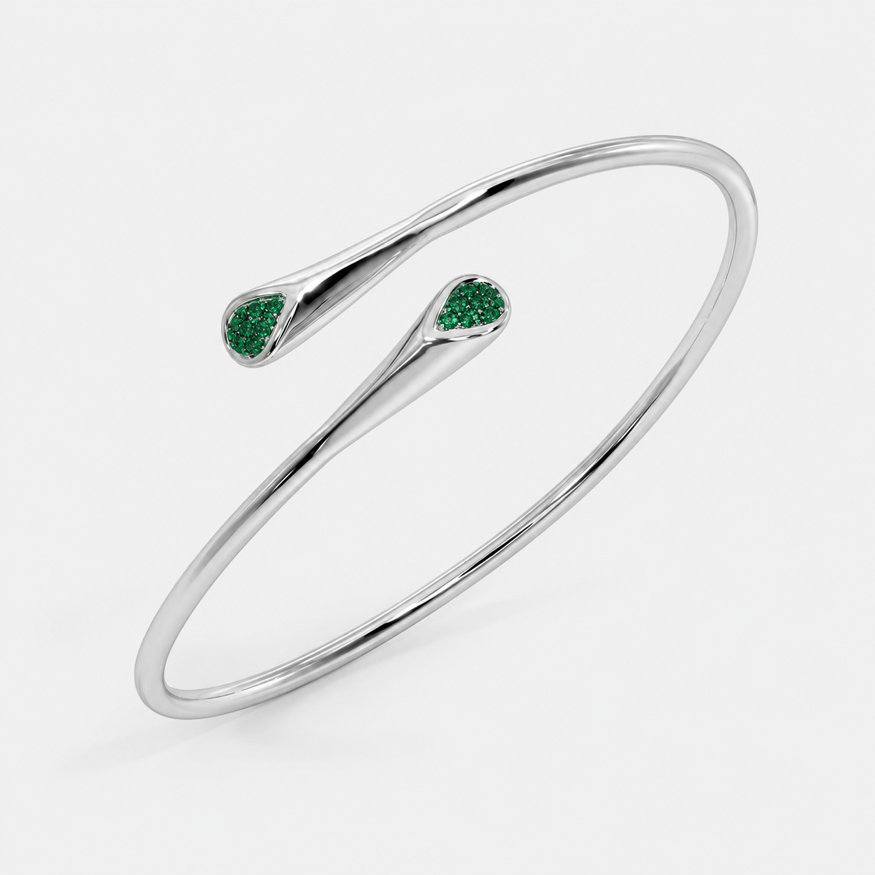 Silver-tone open cuff bracelet with emerald green pavé cubic zirconia accents