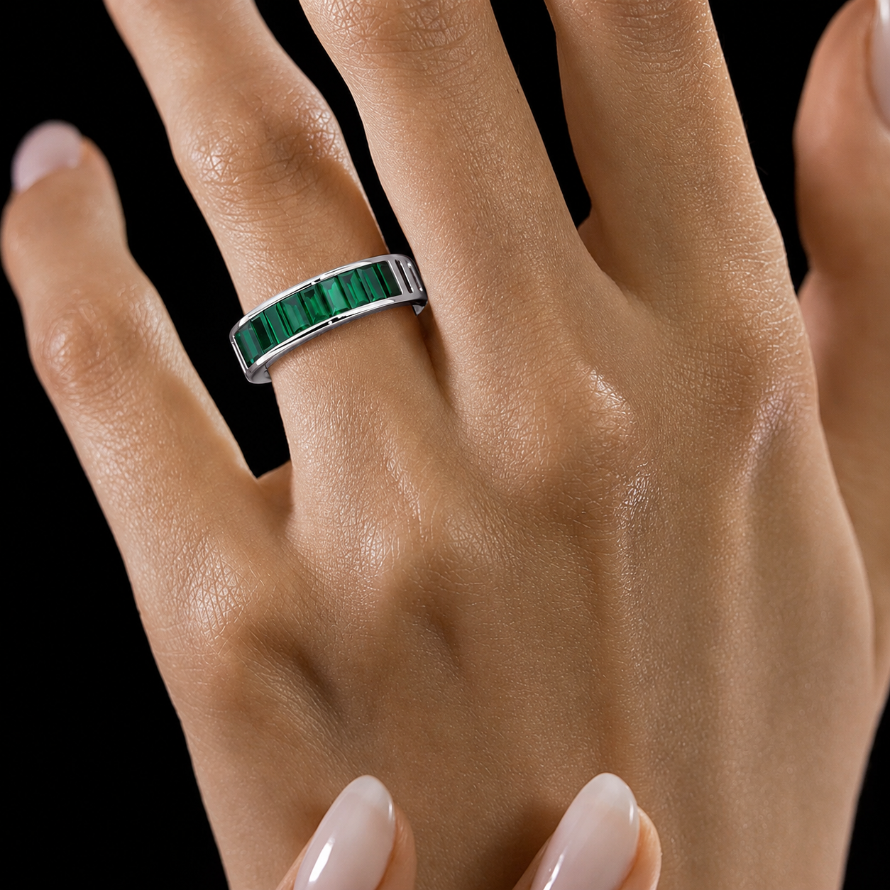 Contemporary emerald green baguette stone ring with sleek channel-set design for women