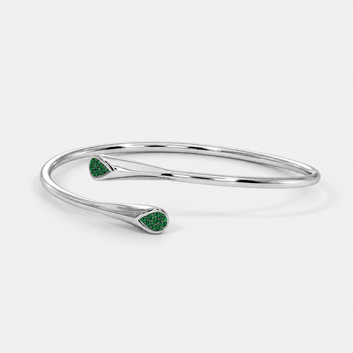 Front view of silver-tone open cuff bracelet featuring emerald green pavé cubic zirconia