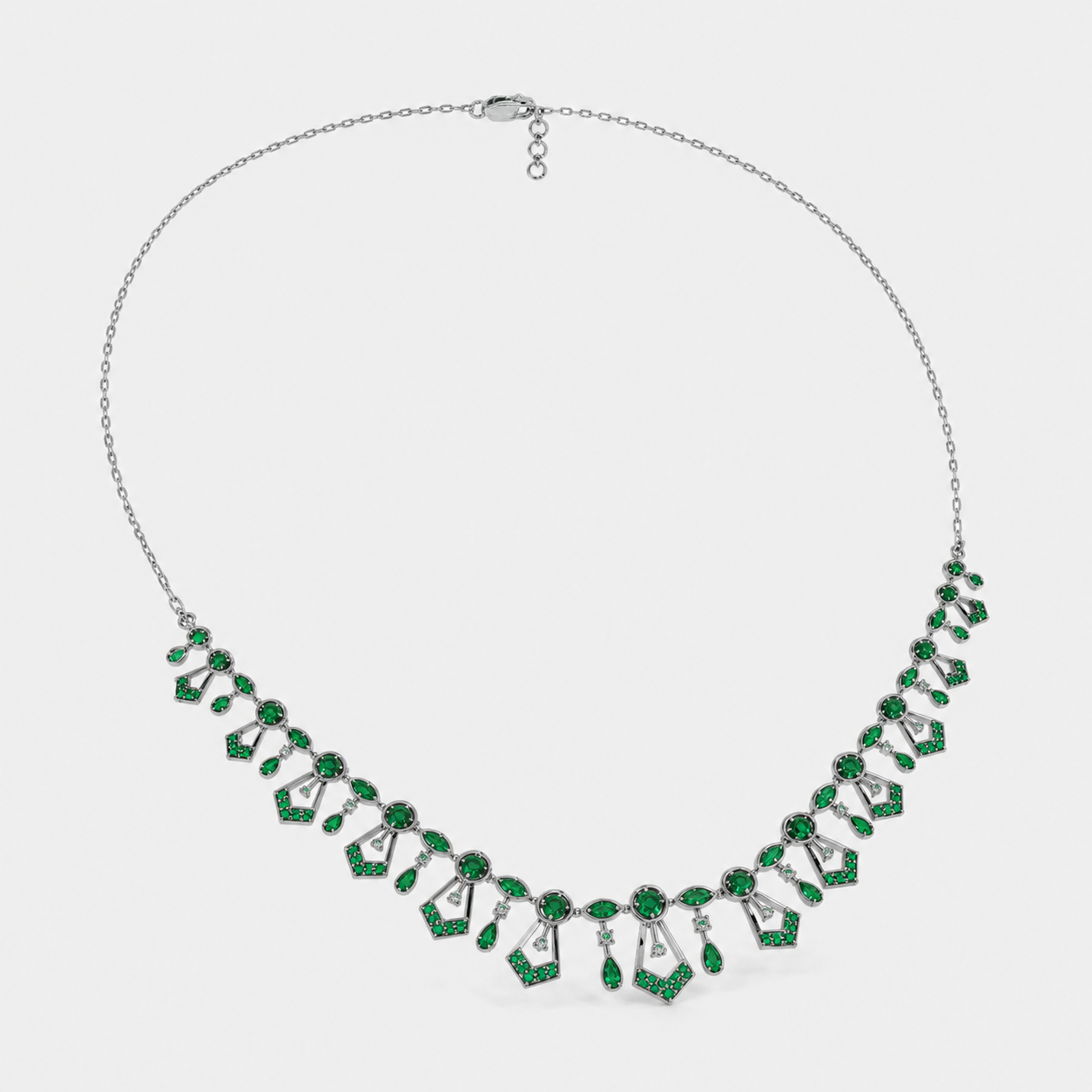 Close-up view of emerald green cubic zirconia geometric centerpiece on silver-tone Art Deco necklace for women