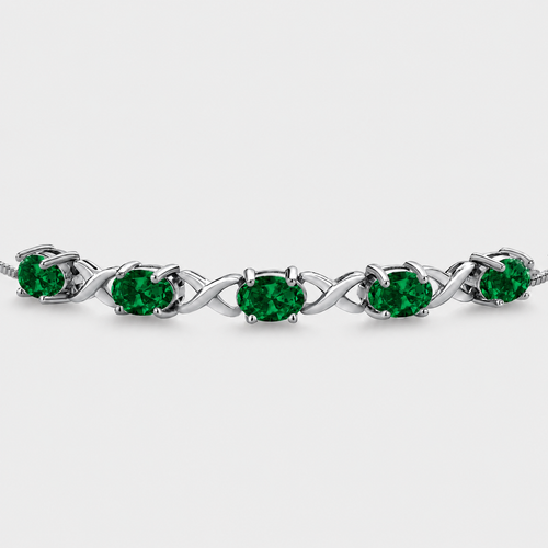Emerald green oval cubic zirconia adjustable tennis bracelet with silver-tone infinity link design