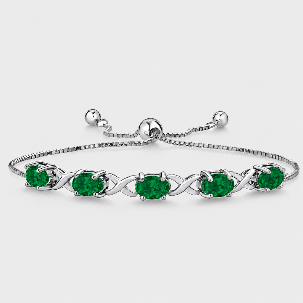 Emerald green oval cubic zirconia adjustable tennis bracelet with silver-tone infinity link design