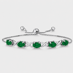 Emerald green oval cubic zirconia adjustable tennis bracelet with silver-tone infinity link design