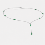Front view of silver-tone Y-drop necklace featuring emerald green butterfly-inspired cubic zirconia accents and dangling pendant detail