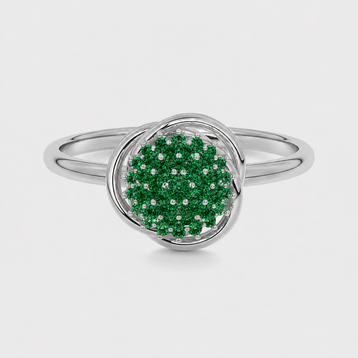 Front view of silver-tone halo ring with emerald green cubic zirconia cluster centerpiece