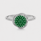 Front view of silver-tone halo ring with emerald green cubic zirconia cluster centerpiece
