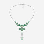 Front view of silver-tone statement necklace featuring emerald green floral cubic zirconia arrangement with tassel drop accents