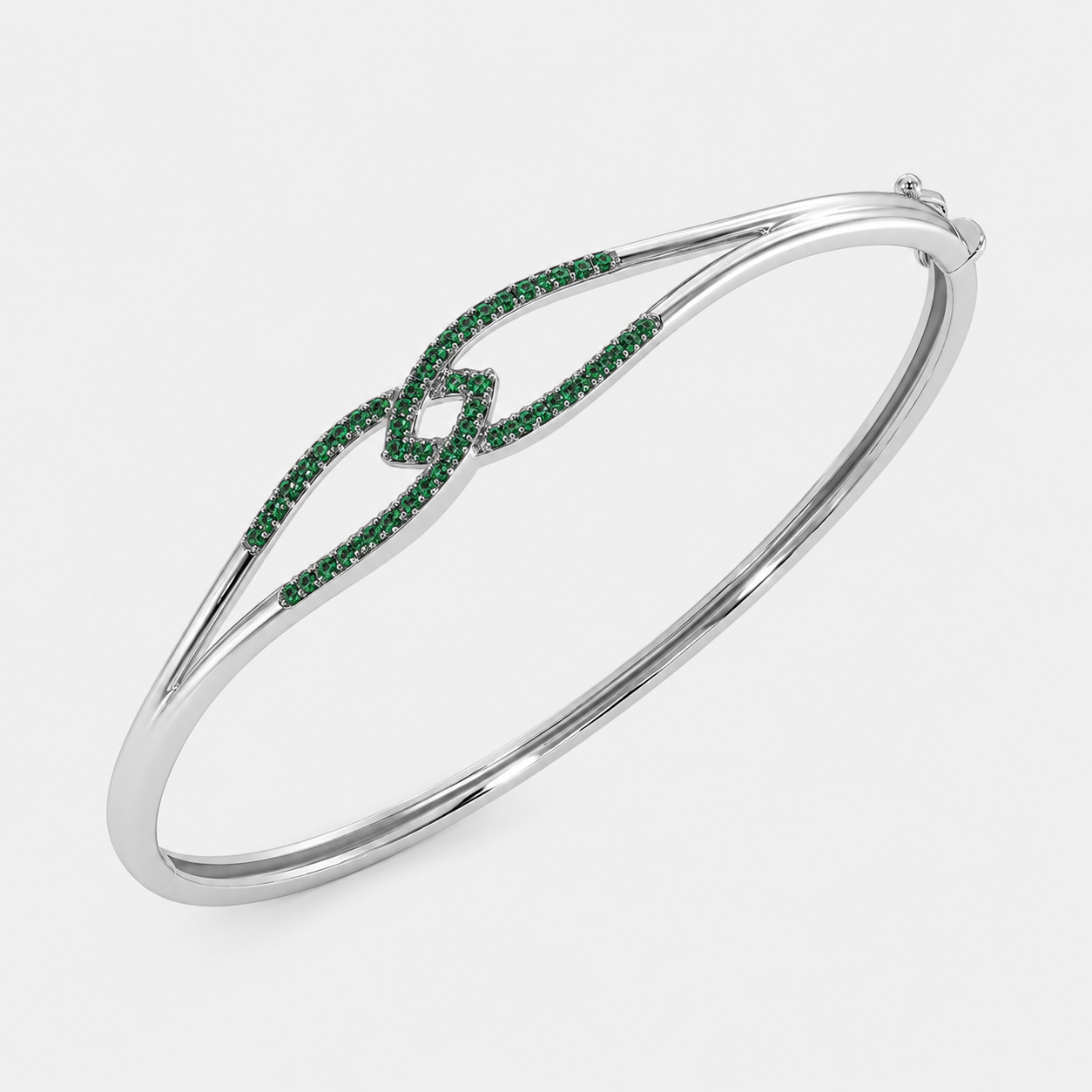 Silver-tone open cuff bracelet with emerald green pavé cubic zirconia accents on both ends