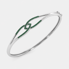 Silver-tone open cuff bracelet with emerald green pavé cubic zirconia accents on both ends