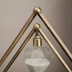Hourglass with geometric metal frame – Meditation timer with white sand