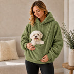 Sage green sherpa pet carrier hoodie with a small dog in the front pouch